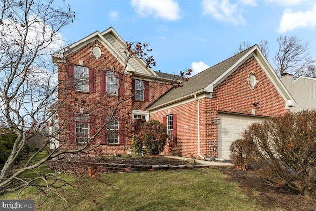 view of front property with a garage and a front lawn