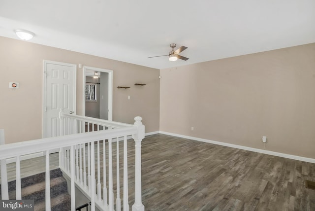 empty room featuring hardwood / wood-style flooring and ceiling fan