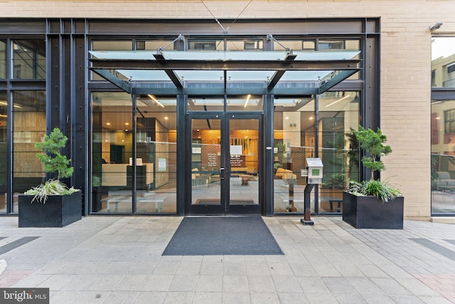 entrance to property with french doors and brick siding