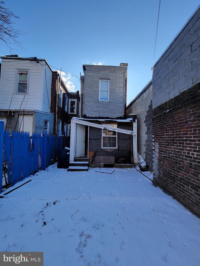 view of snow covered house