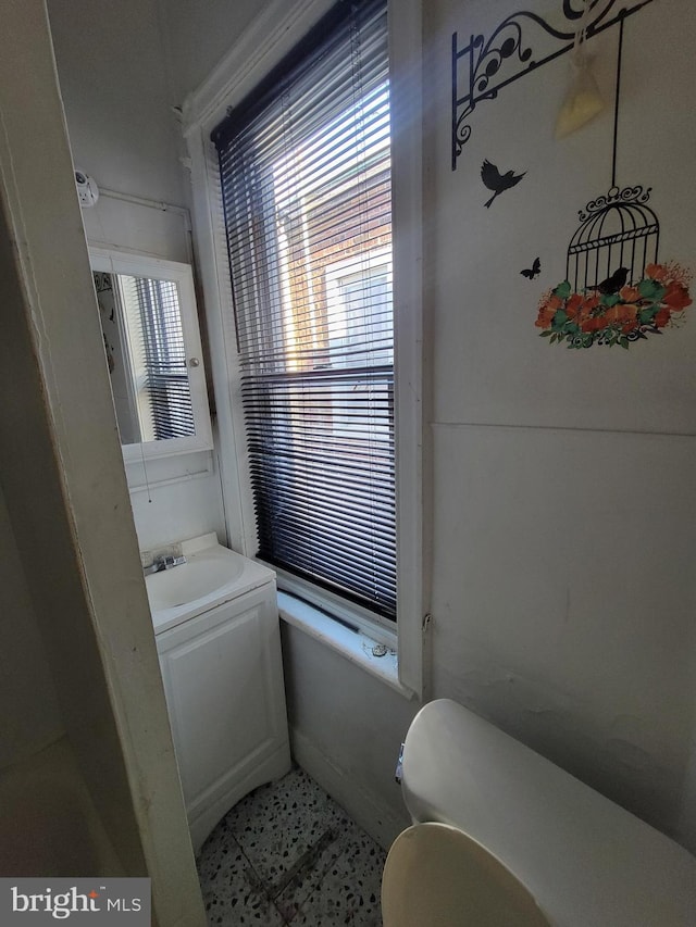 bathroom featuring tile patterned flooring, vanity, and toilet