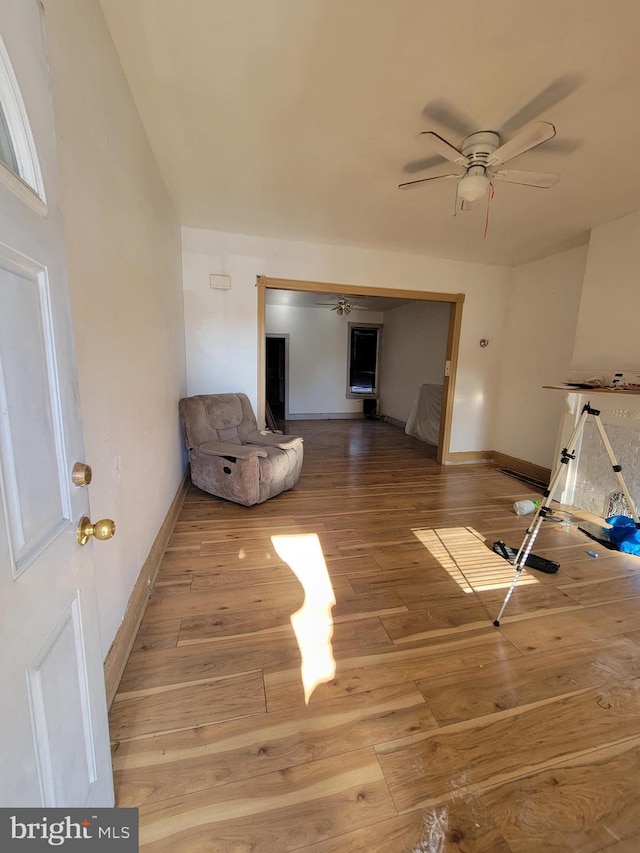 interior space featuring hardwood / wood-style floors and ceiling fan