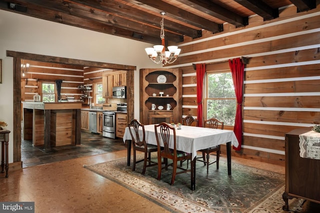 dining space with a chandelier, wooden walls, beam ceiling, and wooden ceiling