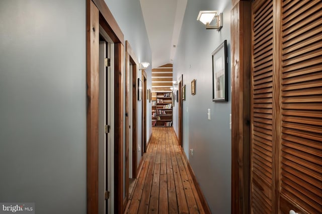 corridor with wood-type flooring