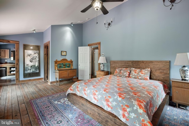 bedroom featuring lofted ceiling, hardwood / wood-style flooring, and a ceiling fan