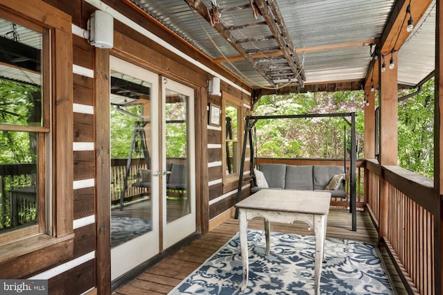sunroom featuring an outdoor living space