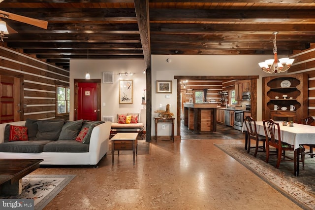 living room with a chandelier and beam ceiling