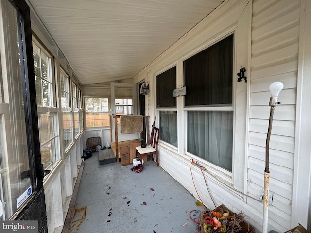 unfurnished sunroom with vaulted ceiling