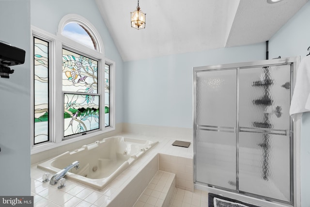 bathroom with vaulted ceiling and plus walk in shower