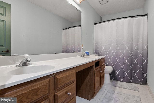 bathroom featuring walk in shower, vanity, and toilet