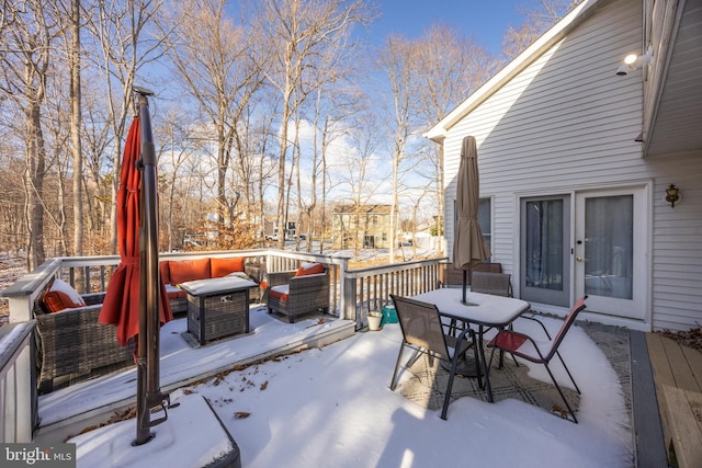 view of snow covered deck