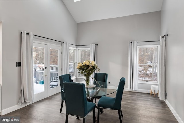 dining space with french doors, dark hardwood / wood-style flooring, and plenty of natural light