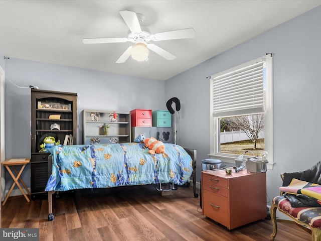 bedroom featuring hardwood / wood-style floors and ceiling fan