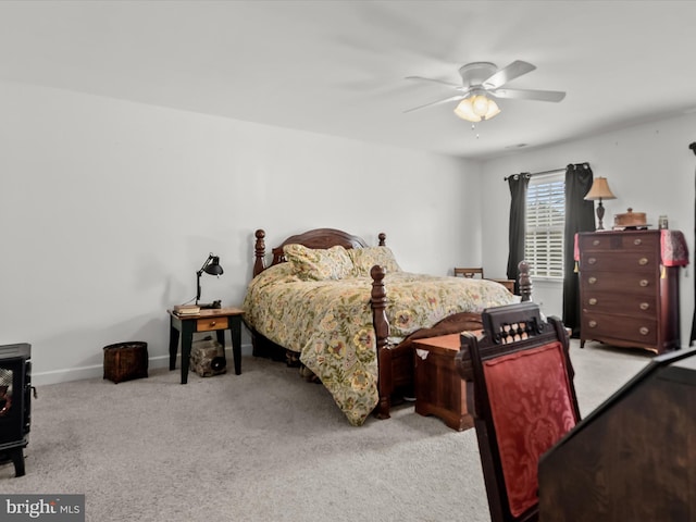 bedroom featuring light colored carpet and ceiling fan