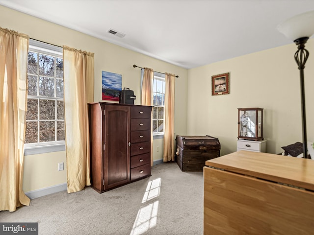 bedroom featuring light carpet