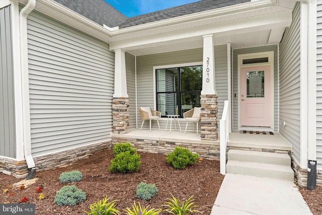 doorway to property with covered porch