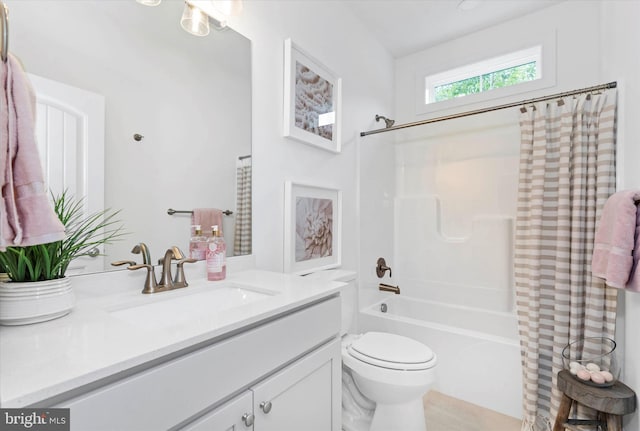 full bathroom with shower / bath combination with curtain, vanity, and toilet