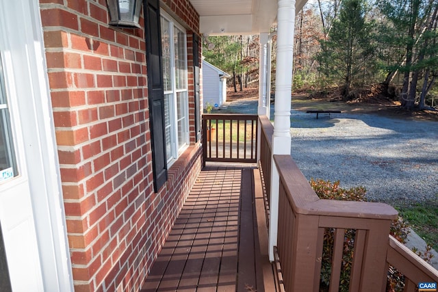 wooden terrace featuring a porch