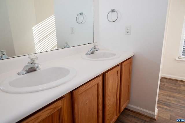 bathroom with hardwood / wood-style floors and vanity