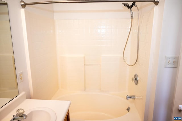 bathroom with bathing tub / shower combination and vanity