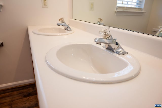 bathroom with wood-type flooring and vanity