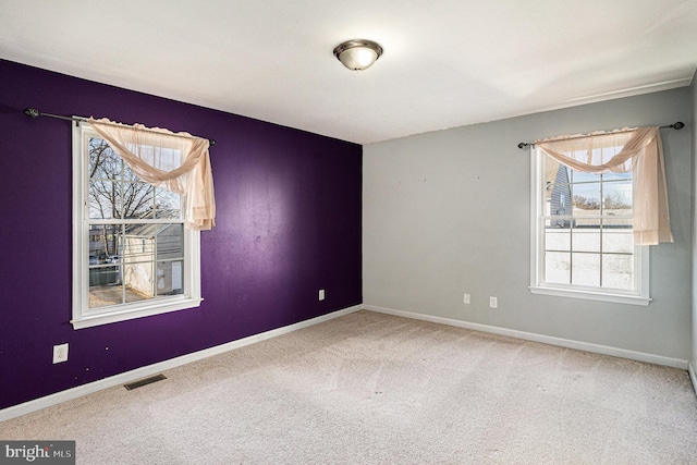 unfurnished room featuring carpet floors