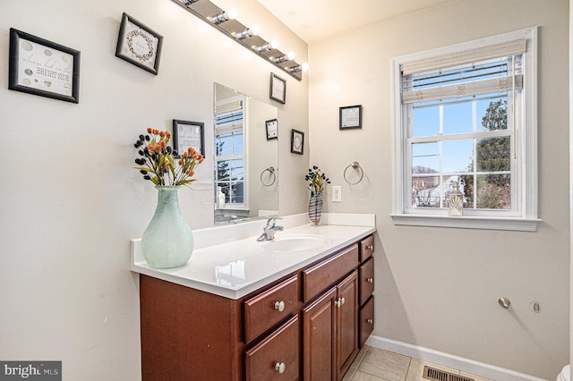 bathroom with tile patterned flooring and vanity