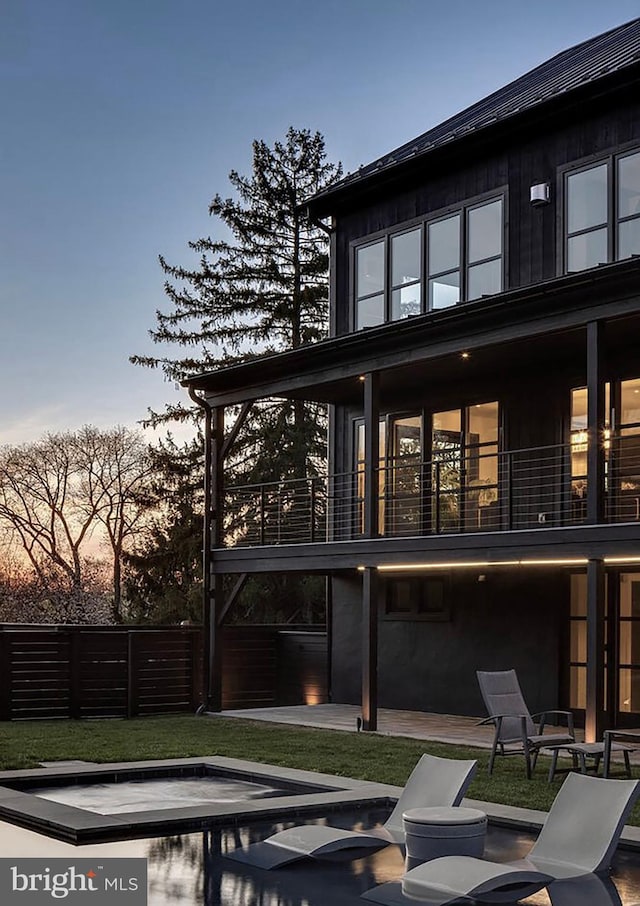 2169 Aquetong Rd, New Hope, PA 18938 - back of house at dusk featuring a patio area and a balcony