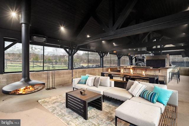 view of patio / terrace with a gazebo, area for grilling, an outdoor living space, and an outdoor bar