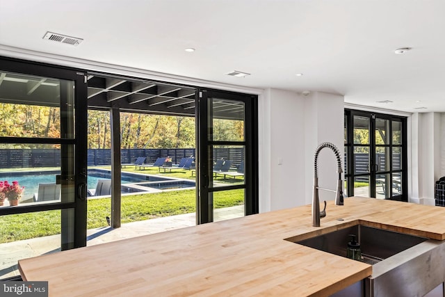 2169 Aquetong Rd, New Hope, PA 18938 - kitchen featuring wooden counters, plenty of natural light, and recessed lighting