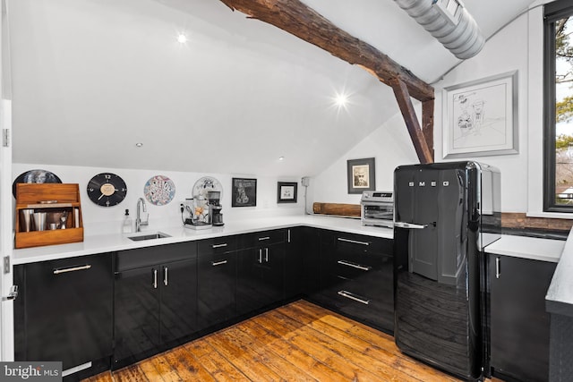 2169 Aquetong Rd, New Hope, PA 18938 - kitchen featuring dark cabinets, light wood-style flooring, and light countertops