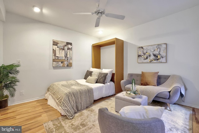 bedroom featuring ceiling fan and hardwood / wood-style flooring