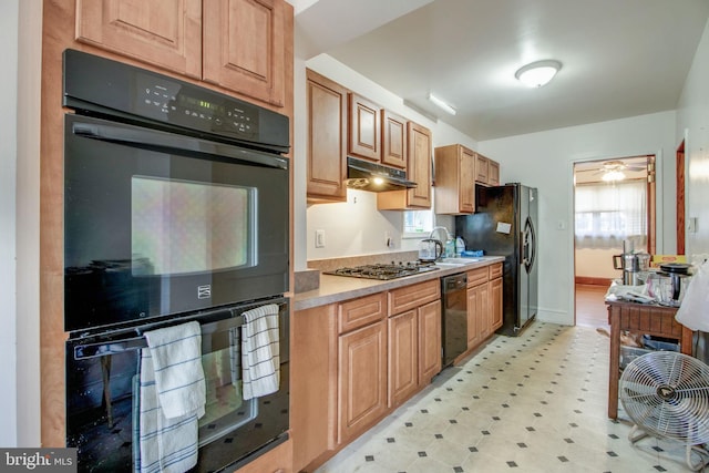 kitchen featuring ceiling fan, sink, and black appliances