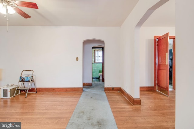 interior space with ceiling fan and light hardwood / wood-style flooring