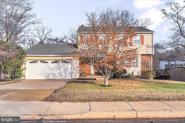 view of front property featuring a front yard and a garage