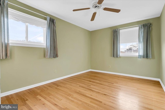 spare room with ceiling fan and light hardwood / wood-style floors