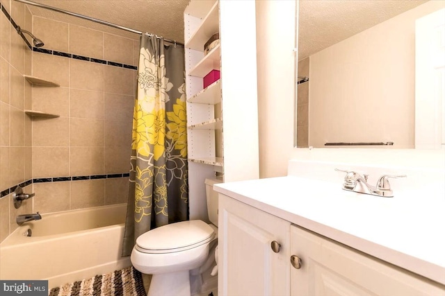 full bathroom with vanity, shower / tub combo, a textured ceiling, and toilet