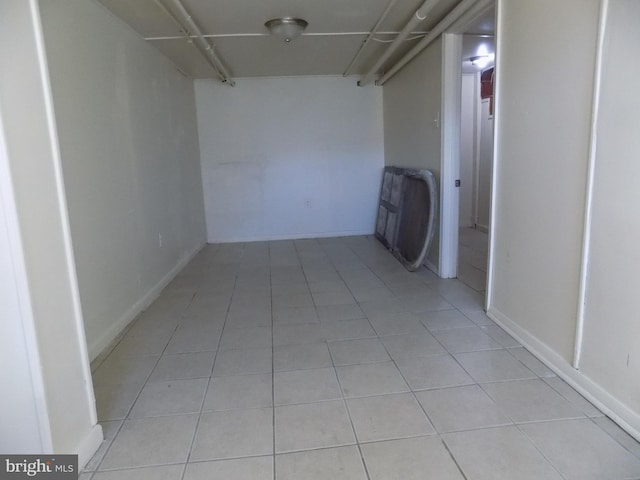 hall featuring light tile patterned floors