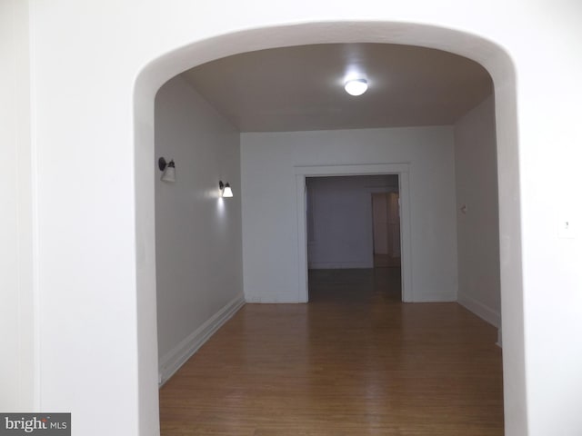 hall featuring dark wood-type flooring