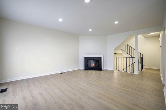 unfurnished living room with light wood-type flooring