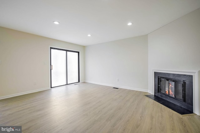 unfurnished living room with light wood-type flooring