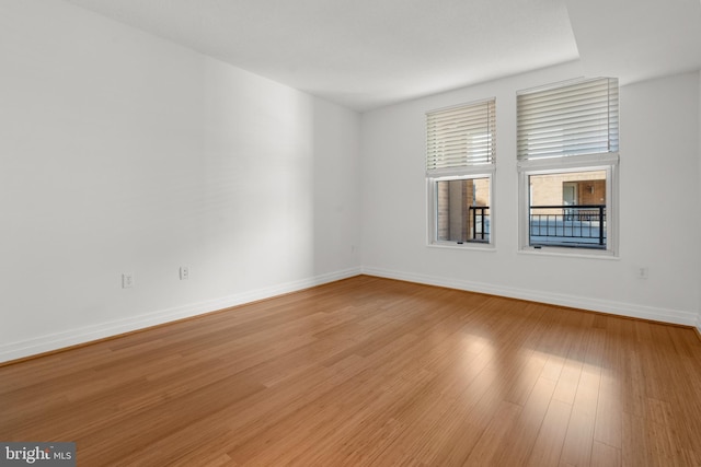 unfurnished room with light hardwood / wood-style flooring