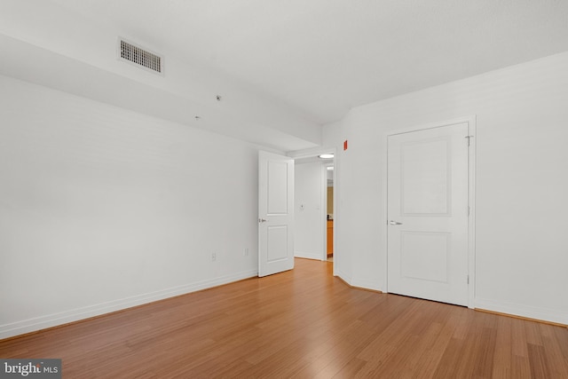 unfurnished room with light hardwood / wood-style floors