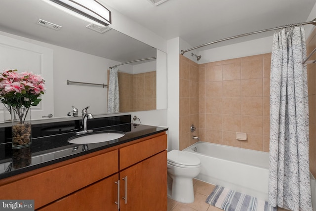 full bathroom featuring tile patterned floors, vanity, toilet, and shower / bathtub combination with curtain