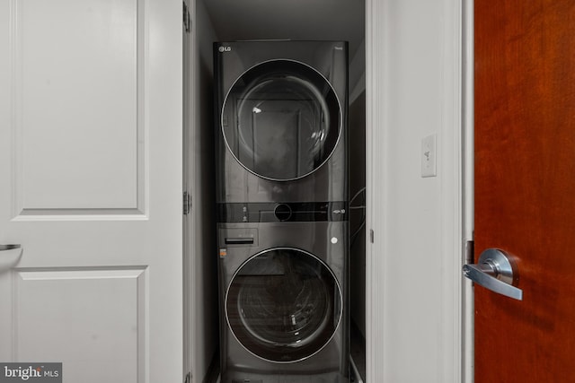 washroom with stacked washer / drying machine