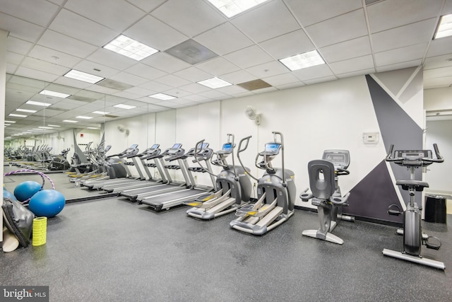 workout area featuring a paneled ceiling