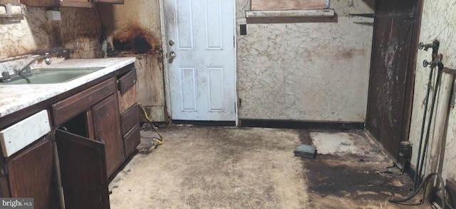 bathroom with concrete flooring and sink