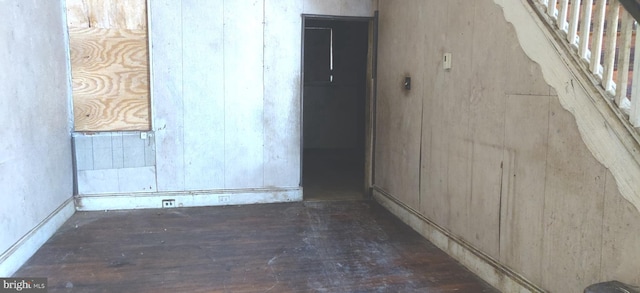 spare room with dark wood-type flooring