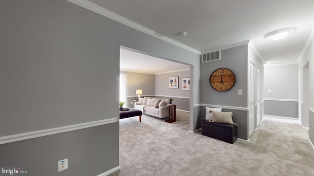 carpeted living room with ornamental molding