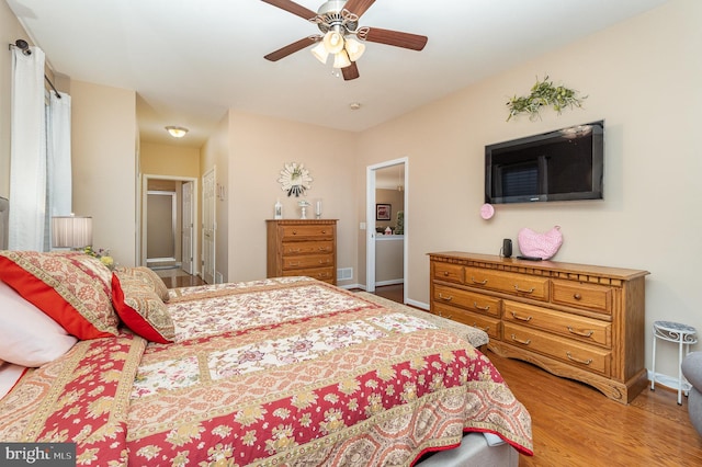 bedroom featuring ceiling fan and hardwood / wood-style flooring